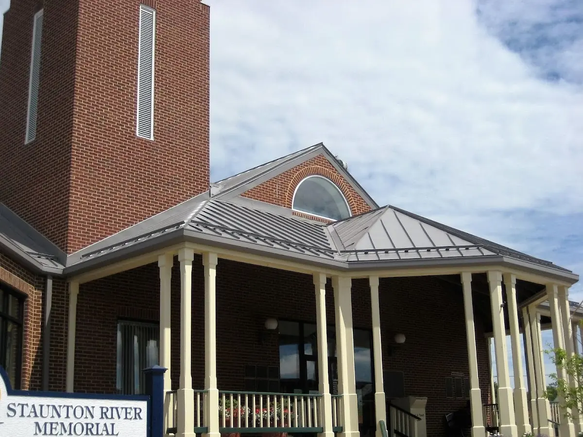 Skilled roofing craftsmen working on a residential roof in Suburbia